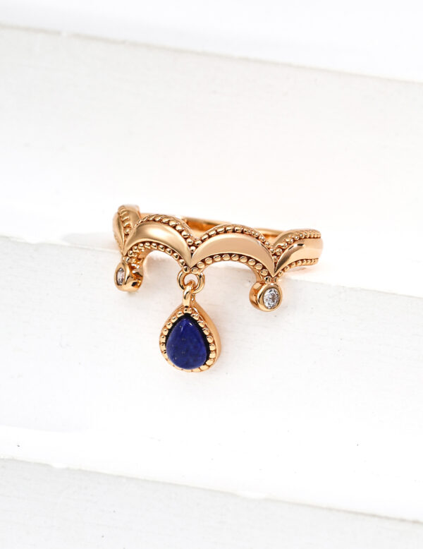 The Oracle’s Whisper Set showcases a harmonious blend of deep blue Lapis Lazuli and vintage gold, featuring the Oracle’s Echo Earrings and Seer’s Vision Ring. The set is designed to empower wearers with wisdom, enhance communication, and provide a sense of serenity, aligning perfectly with the transformative energies of 2025.
